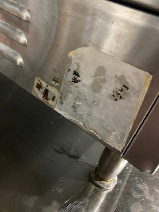 Cecilware stainless steel electric countertop griddle with thermostatic control, back and side splash, on legs. Visible wear on label.