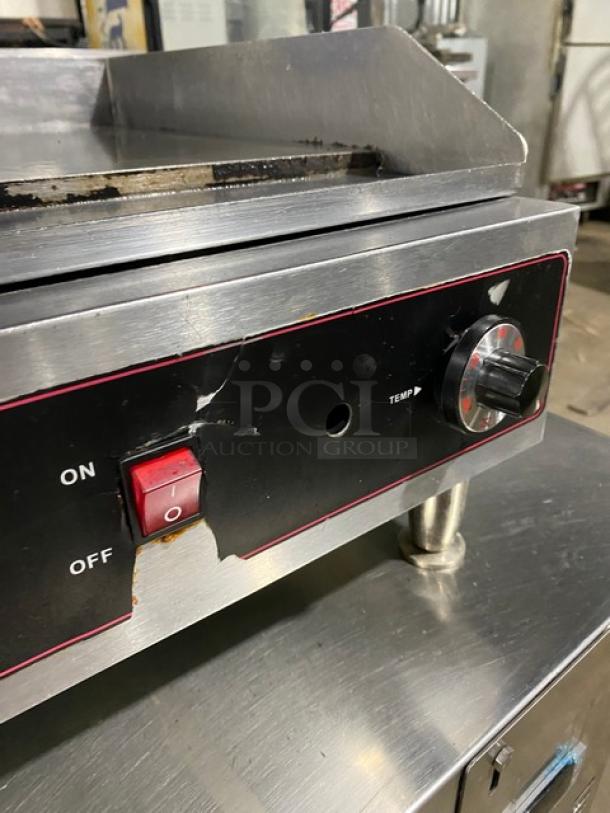 Cecilware commercial stainless steel electric griddle with thermostatic control, back and side splash, on legs. Slight wear visible.