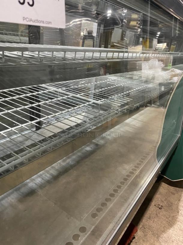 Commercial wooden style straight glass refrigerated deli display with poly-coated wire racks and rear glass sliding doors.