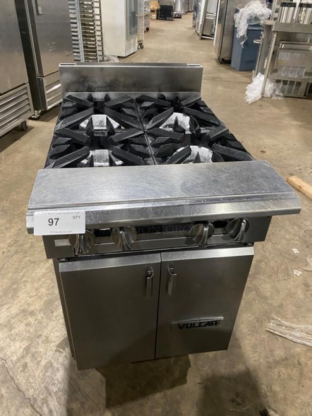 Vulcan stainless steel 4-burner natural gas range with backsplash, enclosed cabinet base, and legs; excellent condition.
