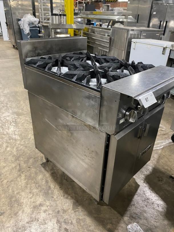 Vulcan commercial stainless steel 4-burner range with backsplash, enclosed cabinet base, on legs. Natural gas powered.