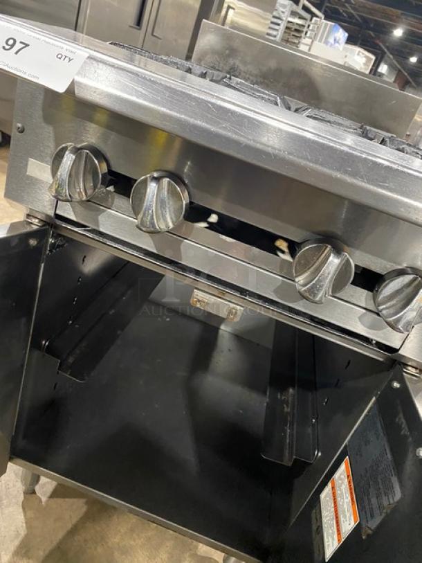 Vulcan commercial stainless steel 4-burner range, natural gas, with backsplash, enclosed cabinet base, on legs, clean condition.