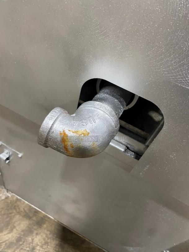 Vulcan commercial stainless steel range gas intake featuring a 4-burner design, enclosed cabinet base, and back splash.