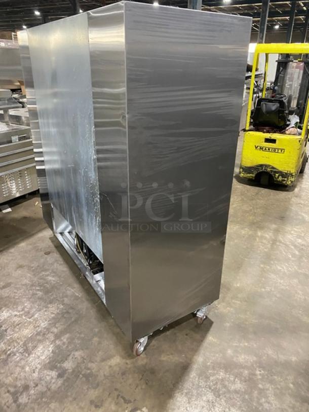 Leader LS72SC commercial stainless steel double glass sliding door refrigerator, chrome wire rack, on casters.