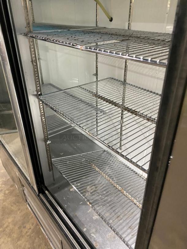 Leader LS72SC Commercial Stainless Steel Double Glass Sliding Door Reach-In Merchandiser Refrigerator with chrome wire racks.