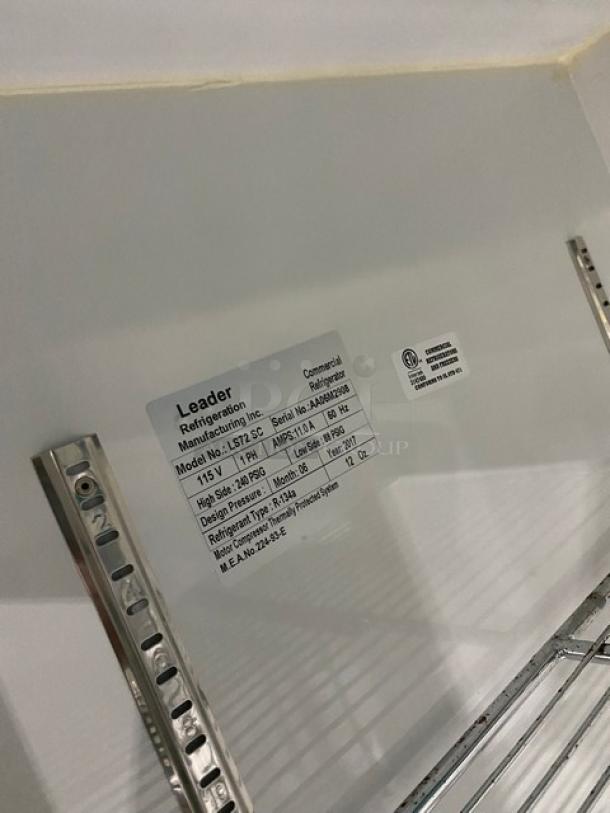 Leader LS72SC commercial refrigerator interior label, showing model and specifications. Chrome wire rack and steel tracks visible.