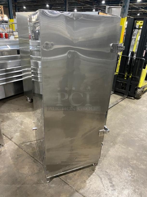 Commercial stainless steel natural gas smoker oven on legs. Free-standing, full-size. Polished exterior, robust construction.