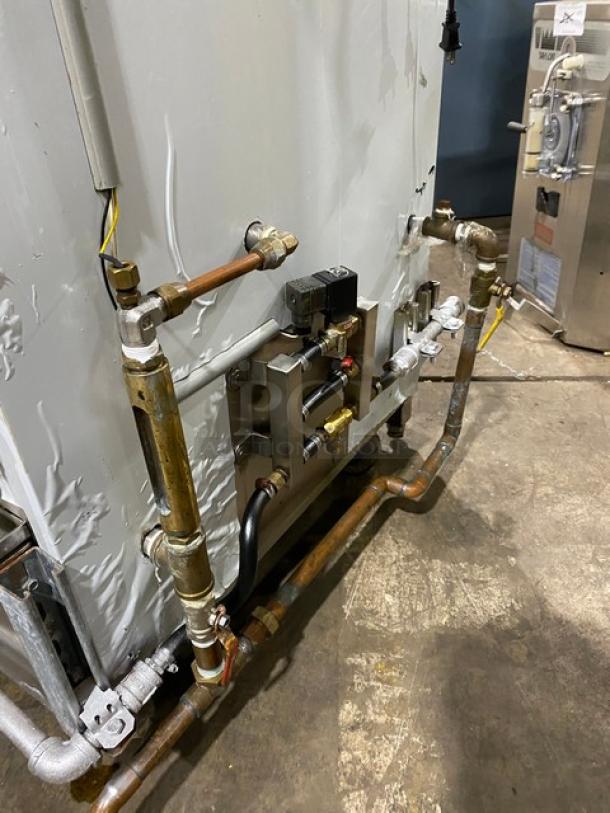 Commercial stainless steel natural gas smoker oven on legs, showing connected piping. Used condition, ideal for businesses.