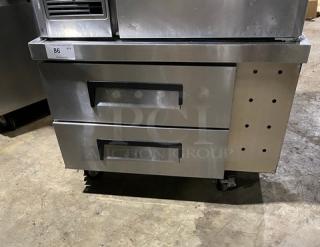 Commercial stainless steel 2-drawer refrigerated chef base, 115V, on casters. Features durable construction and mobility.