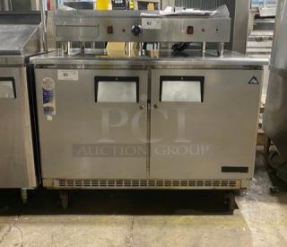 Everest ETBR2 stainless steel 2-door undercounter refrigerator with poly-coated wire racks, on casters, 115V, 1 phase.