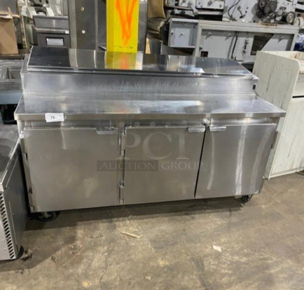 Marsal BM72R 72" stainless steel pizza prep table, 3 doors, pan slides, shelves, on casters. No compressor.