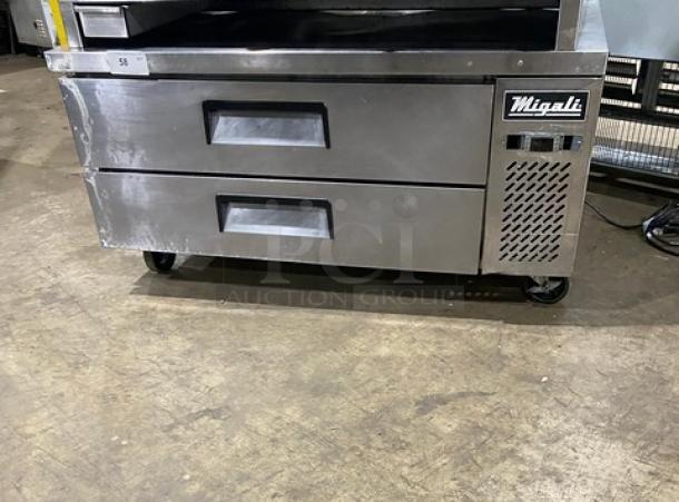 Migali commercial stainless steel 2-drawer refrigerated chef base on casters, showing brand label and sturdy construction.