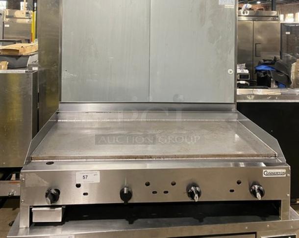 Connerton CG48M stainless steel natural gas countertop flat griddle, features back and side splash, Model: CG-48M, SN: 104027J21.