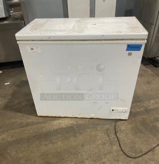 GE Appliances Commercial Chest Freezer FCM7SUFWW, white, visible wear, 115V, SN: AA105789, utility and power labels visible.