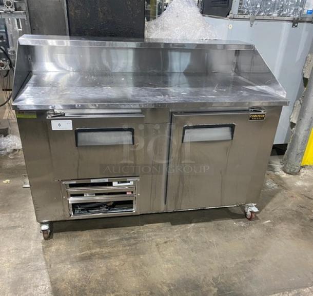 Commercial stainless steel 2-door pizza prep table, Cooltech model CTR-60DR, on casters, 115V, 1 phase, in used condition.