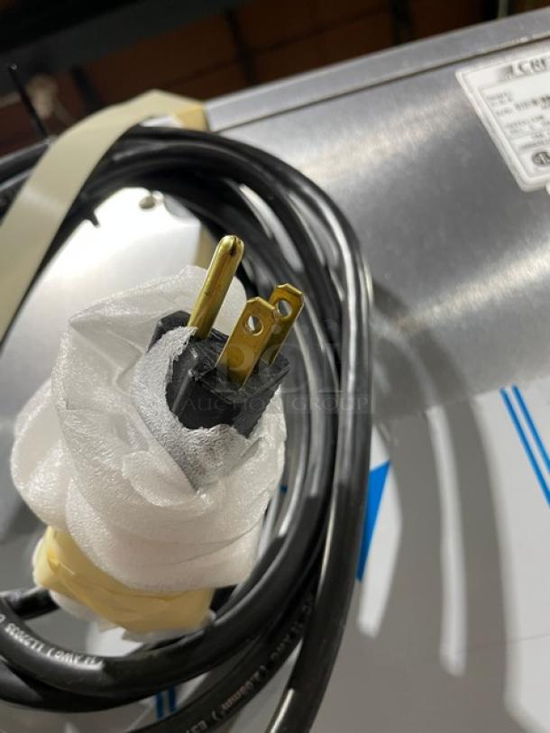 Brand new Cres-Cor H-137-UA-12D stainless steel electric heated cabinet, showing 120V plug and model label.