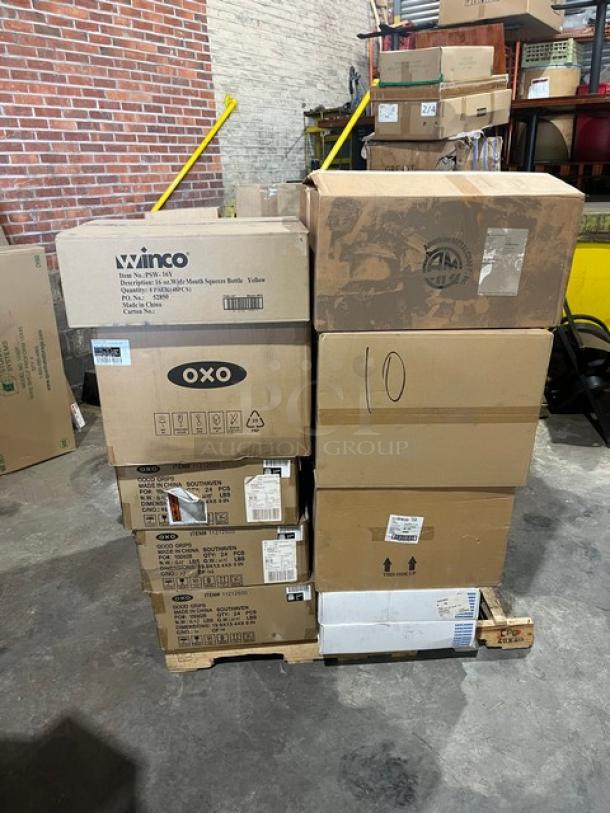 Mixed pallet with Kohler stainless steel wipes dispenser and assorted commercial kitchenware in original packaging.
