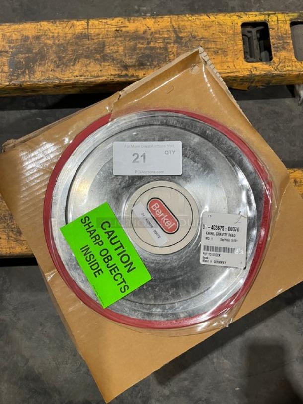 Brand new Berkel gravity feed slicing knife, model 01-403675-00070, in original packaging. Tags indicate sharp object caution.