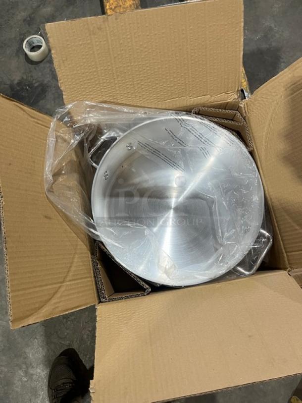 Brand new Winco Commercial Aluminum 15 Qt. Brazier, Model AXBZ15, in original packaging, with protective plastic wrap.