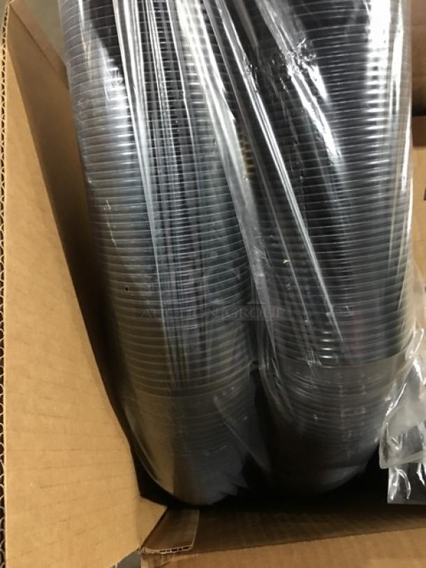 Mixed pallet of commercial kitchen items in box, including clear plastic lids with X-straw slot, packaged in plastic wrap.
