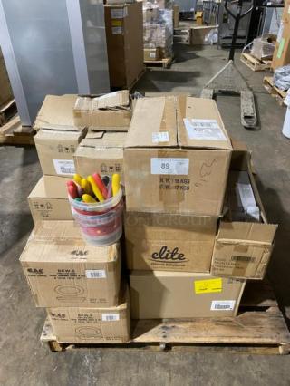 Pallet with boxed CAC BKW-8 porcelain dishes, Chef & Sommelier wine glasses, Walco Monterey teaspoons, and other commercial kitchen items.