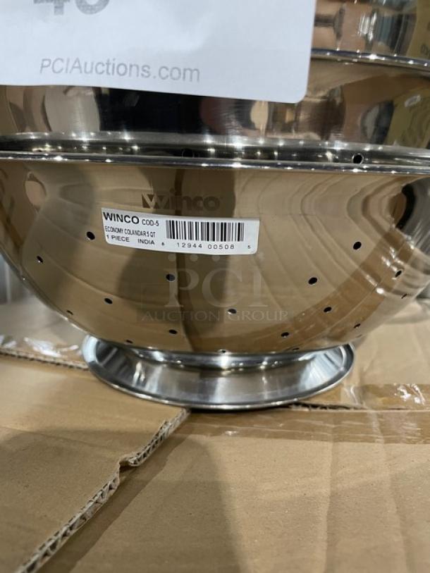 Winco COD5 stainless steel 5 Qt. perforated colander, brand new with handles, label indicating model and origin.