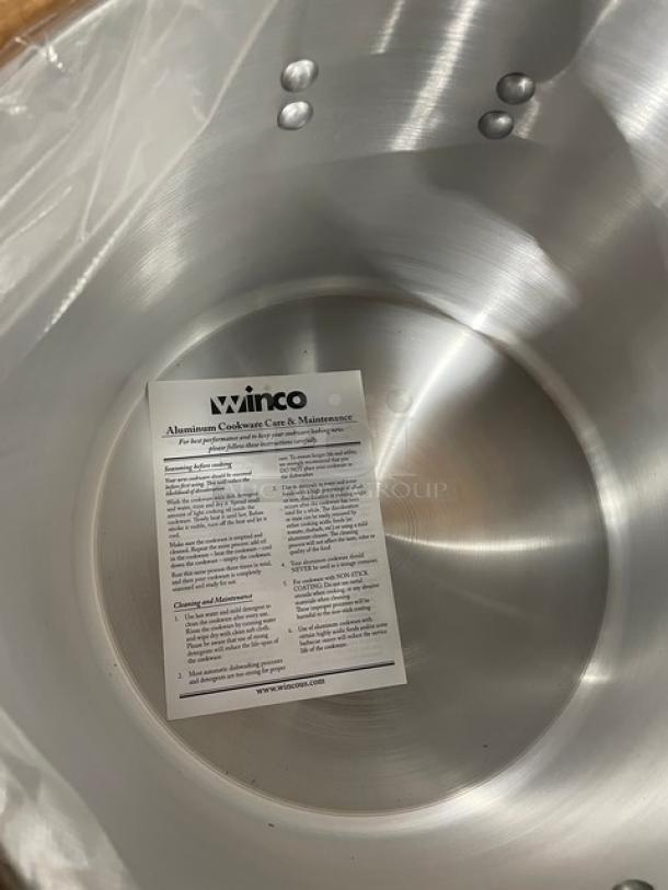 Winco Super Aluminum 26 Qt. Sauce Pot, Model AXAP-26, brand new with handles and care instructions visible.