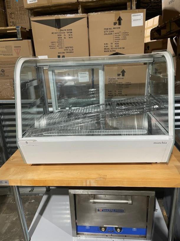 Marchia 36" curved glass refrigerated display case, model MDC161, new condition, adjustable wire rack, LED lighting, rear-access sliding door.