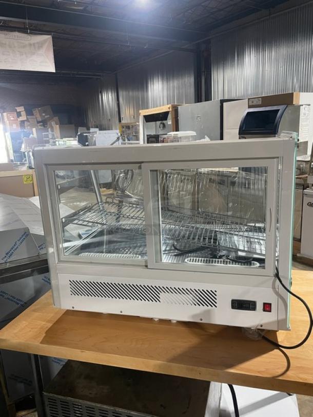 Brand new Marchia MDC161 white 36" curved glass refrigerated display case, LED lighting, chrome wire rack, double glass sliding door.