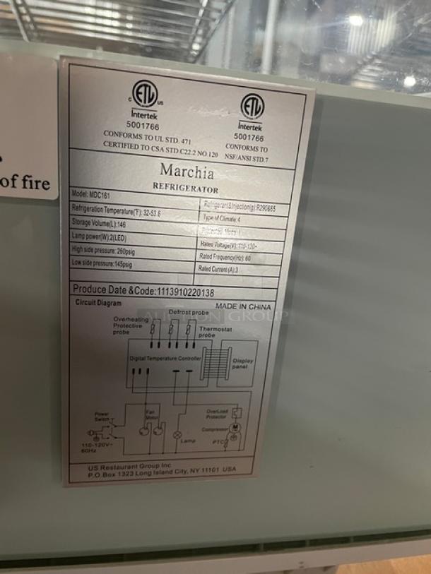 Alt text: Marchia Refrigerated Display Case Model MDC161 label, detailing specifications like storage volume, power, and certification.