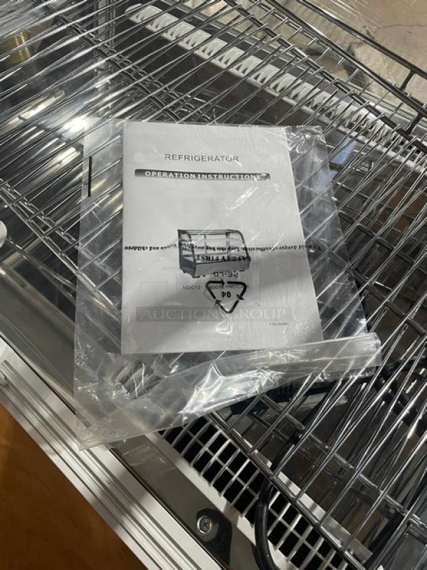 Brand new Marchia MDC161 bakery display case, 36" curved glass, adjustable chrome rack, LED lighting, rear glass doors, manual shown.