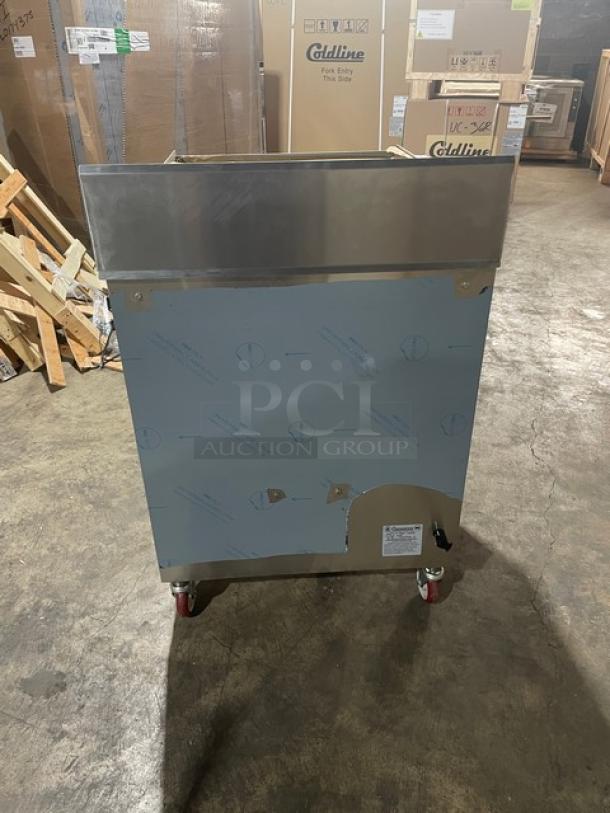 Connerton A1F stainless steel griddle/overfire broiler, brand new, on casters, model SN: 127027A23, wrapped for protection.