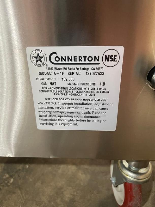 Connerton stainless steel natural gas griddle/overfire broiler, Model A-1F, Serial 127027A23, on casters, brand new.
