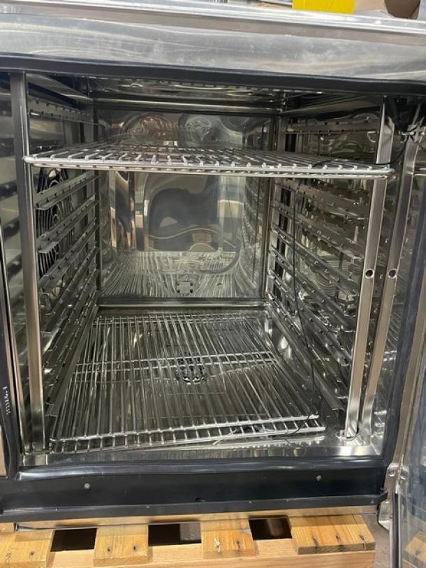 Alto-Shaam CTP7-20E new stainless steel electric combi oven, digital touch controls, 8-pan capacity, model 2024, on legs.