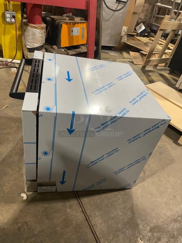 Brand new Moffat TurboFan E23D3 convection oven, stainless steel, half-size, with wire racks, packaging intact, model SN: 2341558.