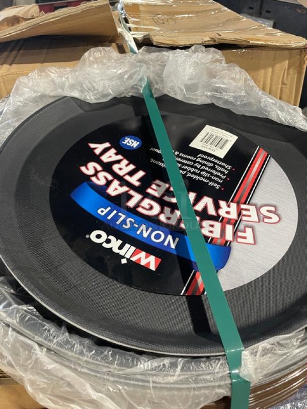 Winco Commercial Black Deluxe Fiberglass 26"x22" Oval Non-Slip Serving Tray, Model: TFG-2622K, wrapped in packaging.
