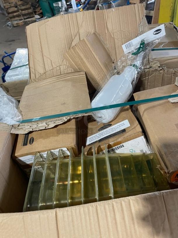 Mixed pallet with various commercial kitchen items, including compostable fiber boxes, clear storage containers, and more, partially unpacked.