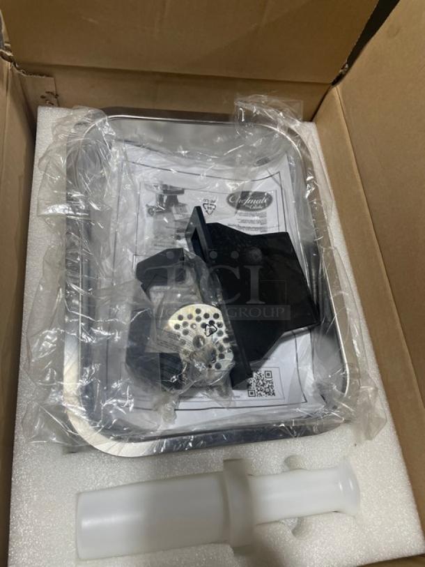 Brand new Globe Chefmate Series CM12 stainless steel meat chopper in box with attachments, 115V 1 Phase, on legs.