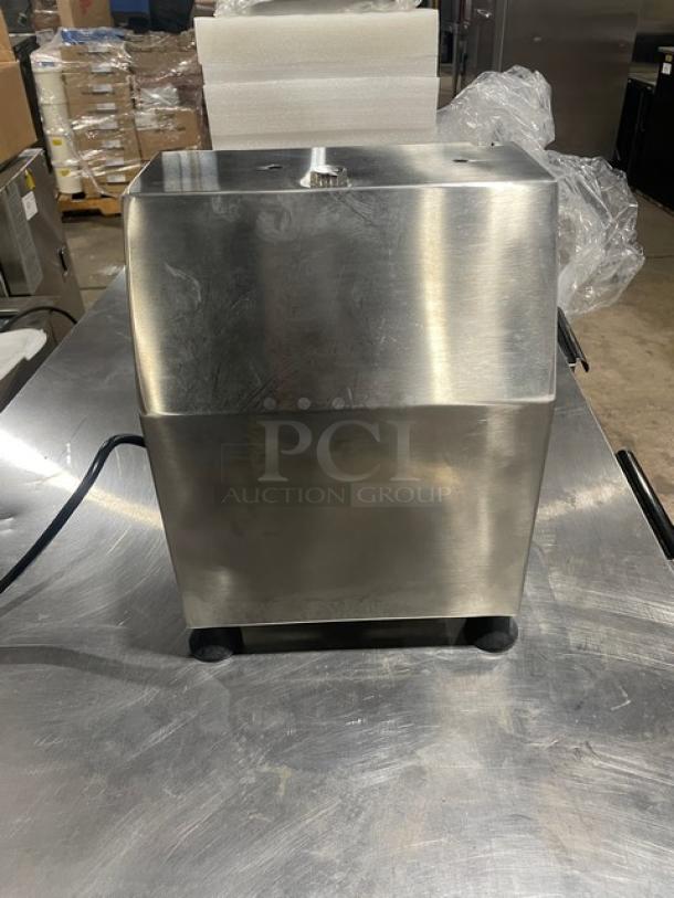 Brand new Globe Chefmate CM12 stainless steel meat chopper, electric-powered, 250 lb capacity, on legs, model SN: 12210875.