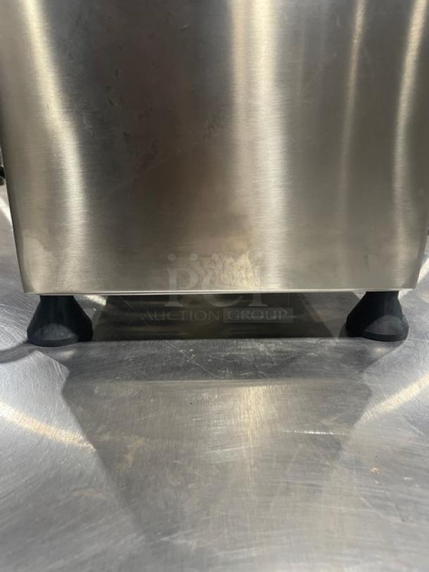 Brand new Globe Chefmate CM12 stainless steel countertop meat chopper, 250 lb capacity, on sturdy legs.