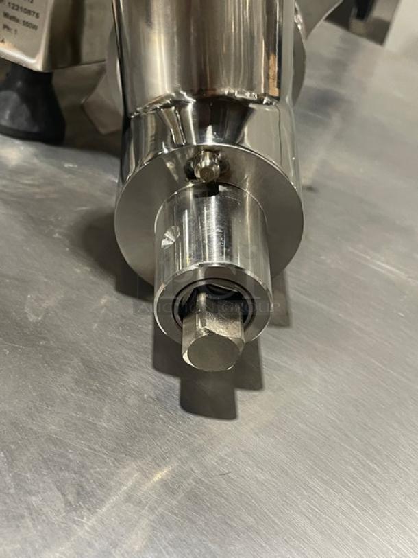 Brand new Globe CM12 Chefmate stainless steel countertop meat chopper, 115V, on legs, with visible serial number 12210875.