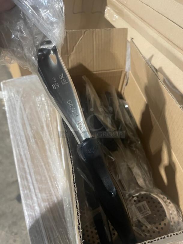 Brand new Vollrath Jacob’s Pride 3 oz perforated spoodle, model 6432320, with black grip handle, in packaging.
