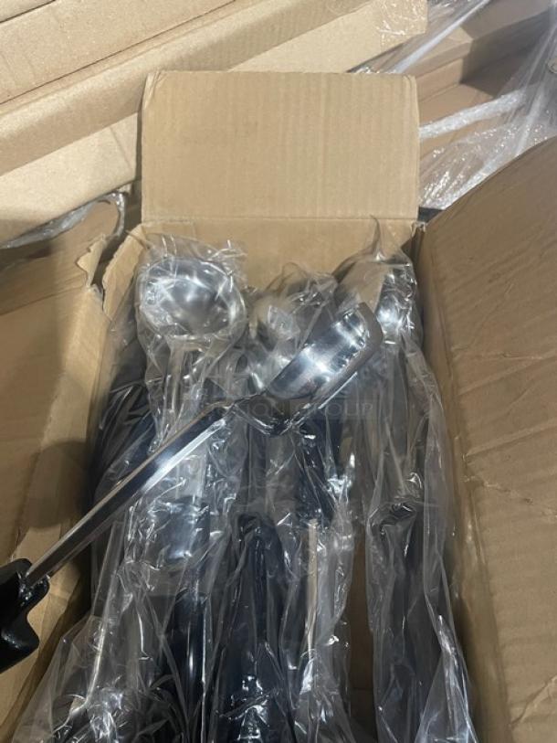 Brand new Vollrath 2 oz. stainless steel spoodle, model 6433220, with black grip handle, in original packaging.