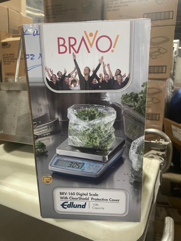 Edlund Bravo Series digital portion scale, model BRV-160, new condition. Features 10 lb. capacity, ClearShield cover, LCD display.