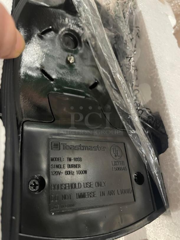 Brand new Toastmaster TM-10SB electric countertop burner, black, with coil top and adjustable temperature control, 120V.