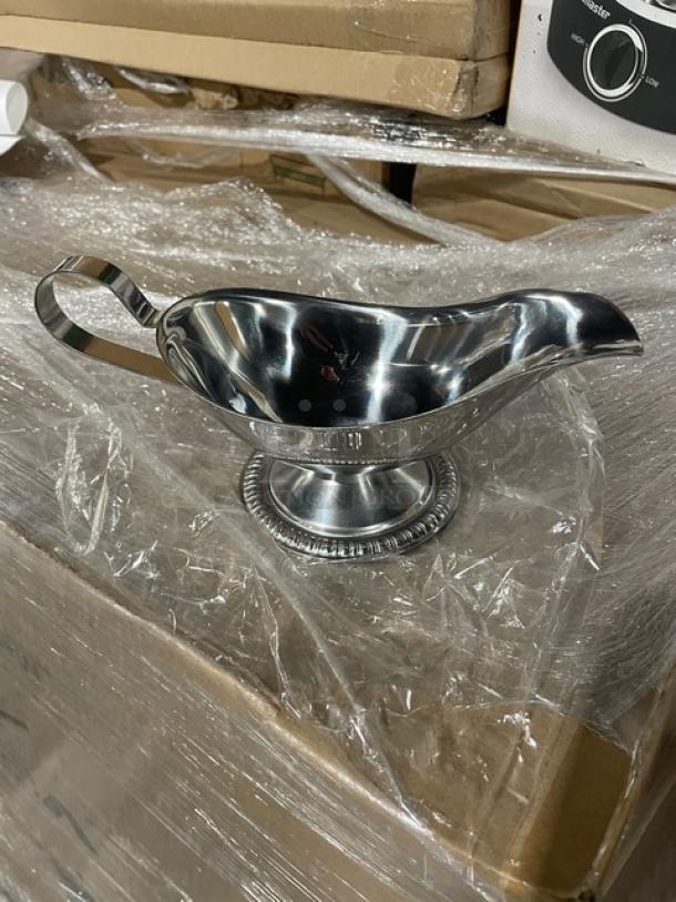 Brand new Vollrath stainless steel gravy boat, model 47578, 8 oz capacity, mirror shine, gadroon style base.