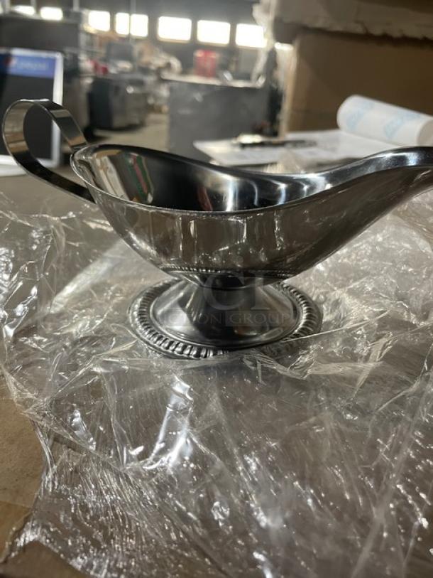 Vollrath 47578, 8 oz. stainless steel gravy boat, mirror finish, gadroon-style base, new condition.