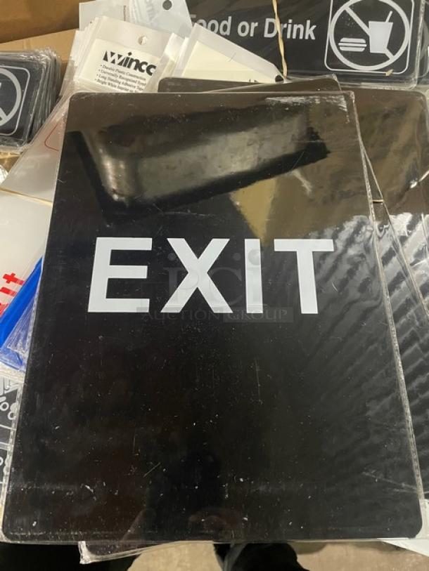 Brand new Winco SGN-805 black "Exit" sign. Bold white lettering. Ideal for commercial use.