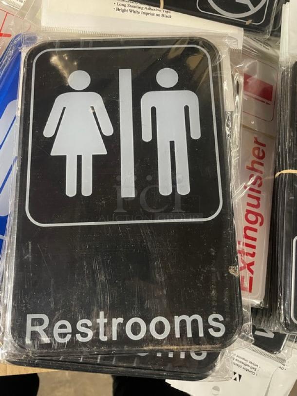 Brand new Winco SGN-603 restrooms sign, black with white symbols. Measures standard size for commercial use.