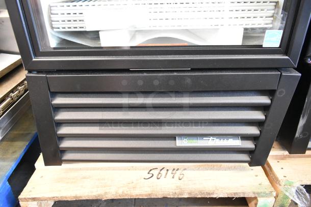 Brand new True GDM-23-HC cooler merchandiser, single door, metal frame, poly coated racks, 115 volts, scratch and dent condition.